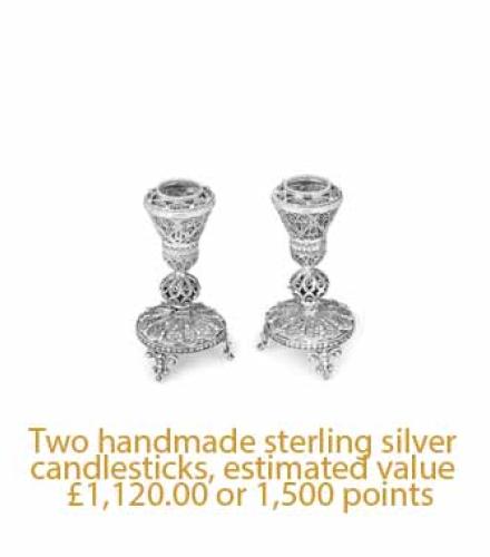 Two handmade sterling silver candlesticks